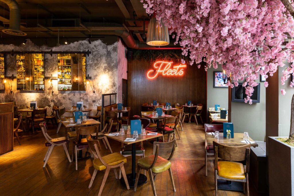 A modern bar with hanging flowers